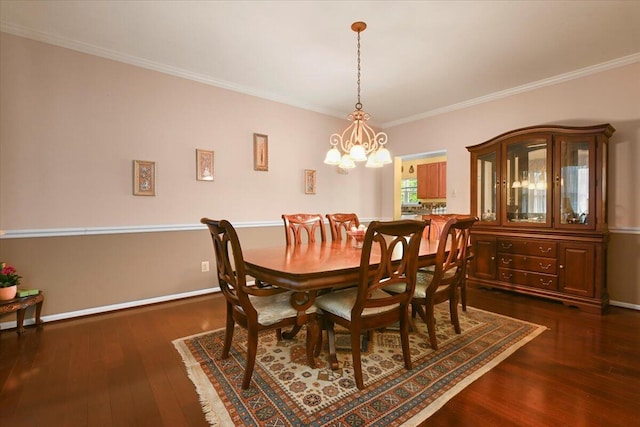2358 Snapdragon Pt, East Stroudsburg, PA 18301 - dining room with dark wood-style flooring, crown molding, and a chandelier