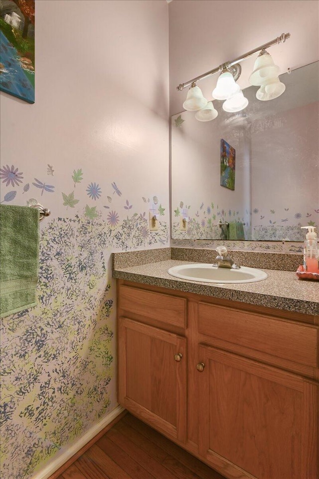2358 Snapdragon Pt, East Stroudsburg, PA 18301 - bathroom featuring vanity, wood finished floors, and wallpapered walls