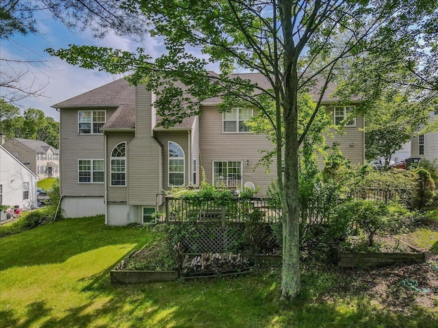 2358 Snapdragon Pt, East Stroudsburg, PA 18301 - back of house with a lawn, a wooden deck, and a garden