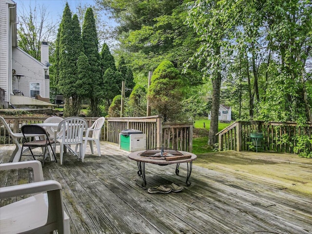 2358 Snapdragon Pt, East Stroudsburg, PA 18301 - wooden deck featuring outdoor dining area and view of scattered trees