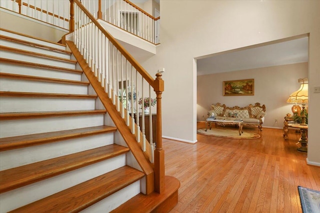 2358 Snapdragon Pt, East Stroudsburg, PA 18301 - staircase with hardwood / wood-style flooring and a high ceiling
