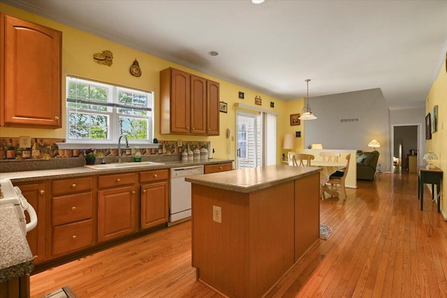 2358 Snapdragon Pt, East Stroudsburg, PA 18301 - kitchen with dishwasher, healthy amount of natural light, a kitchen island, and light wood-style flooring