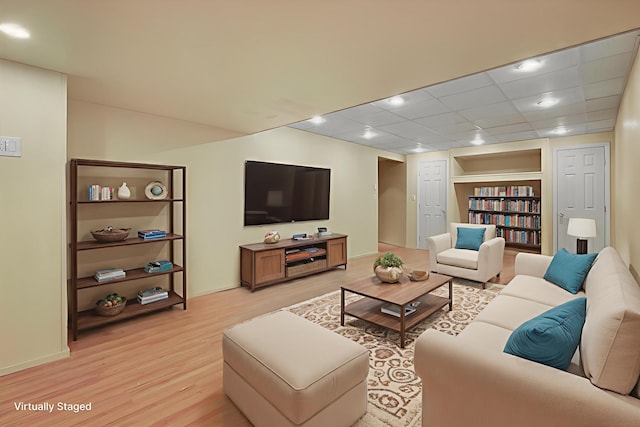 2358 Snapdragon Pt, East Stroudsburg, PA 18301 - living area with light wood-style flooring and a paneled ceiling