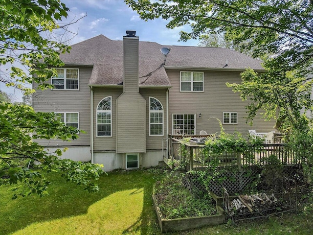 2358 Snapdragon Pt, East Stroudsburg, PA 18301 - back of house featuring a chimney, a wooden deck, and a yard