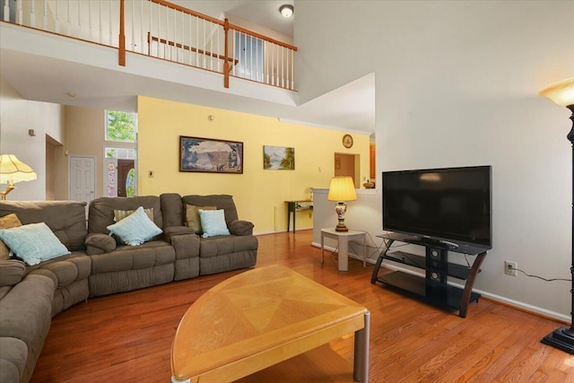 2358 Snapdragon Pt, East Stroudsburg, PA 18301 - living room featuring a towering ceiling and wood finished floors