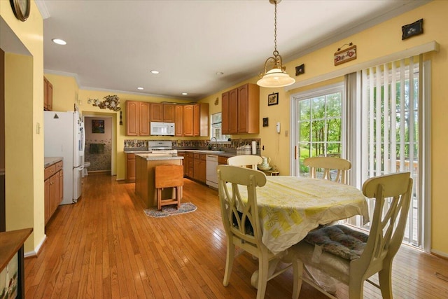 2358 Snapdragon Pt, East Stroudsburg, PA 18301 - dining area with crown molding, light wood-style flooring, and recessed lighting