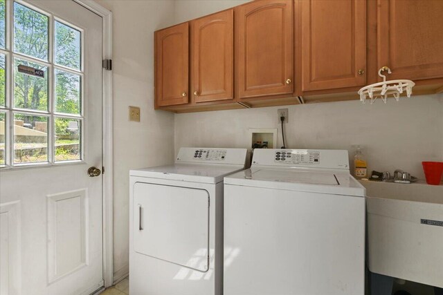 2358 Snapdragon Pt, East Stroudsburg, PA 18301 - laundry area featuring washer and clothes dryer, plenty of natural light, and cabinet space