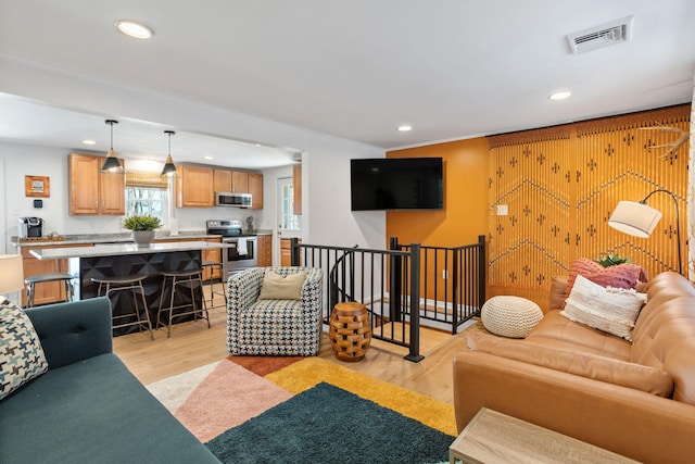 7 Park Ln, Lake Harmony, PA 18624 - living area with recessed lighting, light wood-type flooring, and crown molding