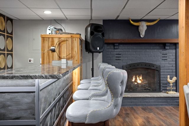 7 Park Ln, Lake Harmony, PA 18624 - living room with a paneled ceiling, wood finished floors, a fireplace, and a dry bar