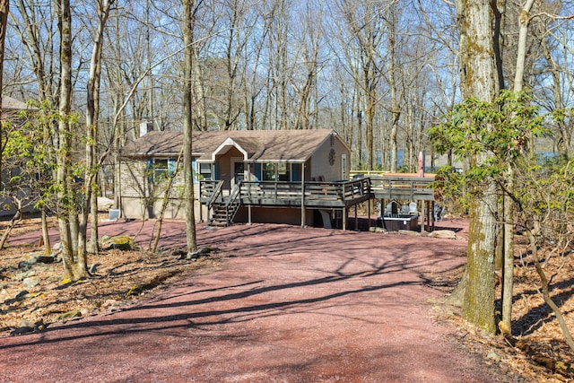 7 Park Ln, Lake Harmony, PA 18624 - view of front of house with a wooden deck and driveway