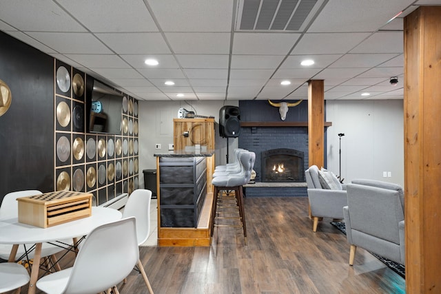 7 Park Ln, Lake Harmony, PA 18624 - living area featuring wood finished floors, a fireplace, recessed lighting, and a drop ceiling