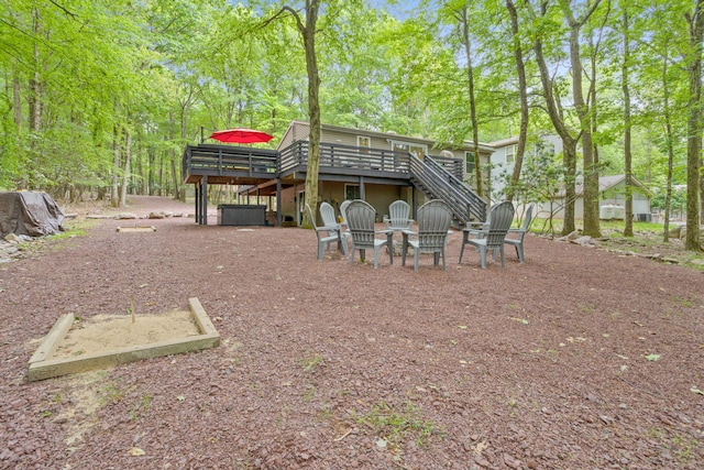 7 Park Ln, Lake Harmony, PA 18624 - rear view of house with stairway, a deck, and view of wooded area