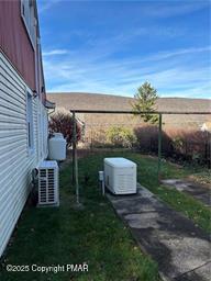 view of yard featuring ac unit and fence