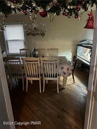 dining space with wood finished floors