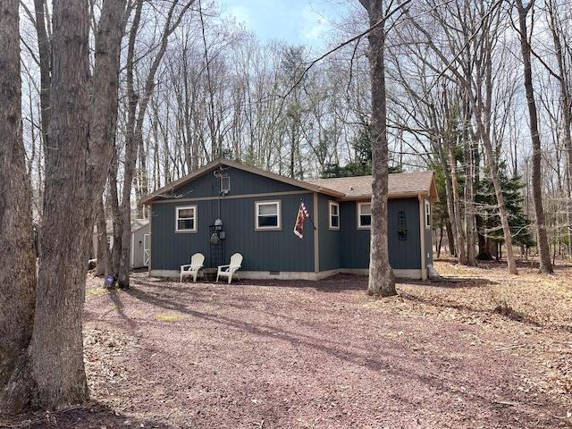 view of front of property featuring roof with shingles