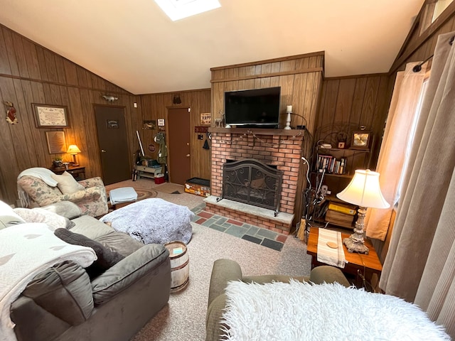 carpeted living room featuring wooden walls, a brick fireplace, and lofted ceiling