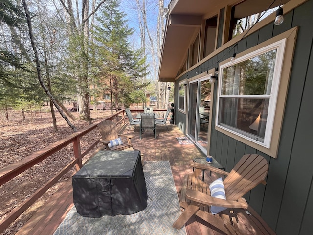 wooden deck featuring outdoor dining space