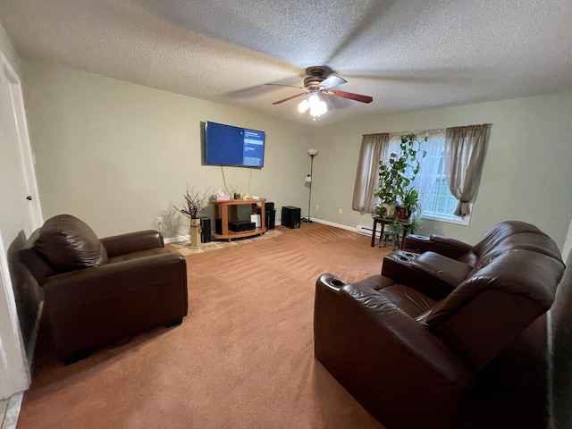 living room featuring carpet floors, ceiling fan, baseboards, and a textured ceiling