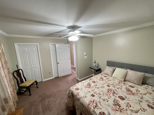 carpeted bedroom with ceiling fan, crown molding, baseboards, and two closets