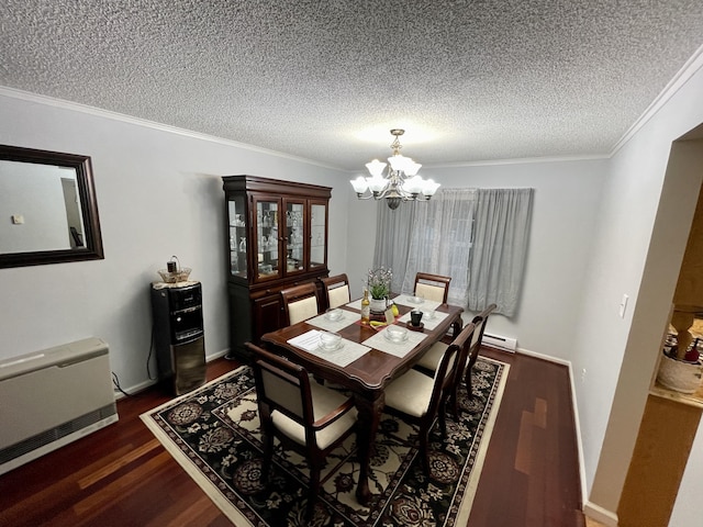 dining area with dark wood-style floors, heating unit, a textured ceiling, crown molding, and a chandelier