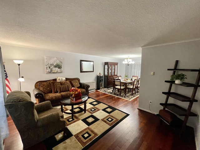 living area featuring a textured ceiling, a chandelier, baseboards, dark wood-style floors, and crown molding