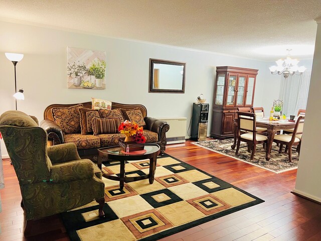 2105 Larkspur Ln, Tobyhanna, PA 18466 - living room featuring a chandelier, ornamental molding, wood-type flooring, and a textured ceiling