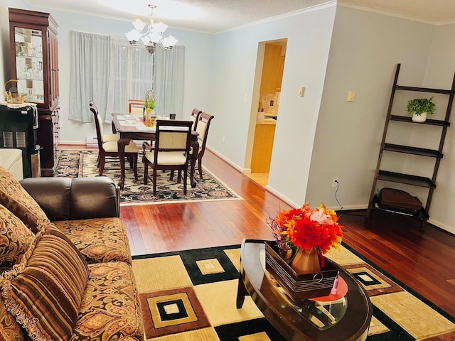 2105 Larkspur Ln, Tobyhanna, PA 18466 - living room with a chandelier, hardwood / wood-style flooring, crown molding, and baseboards