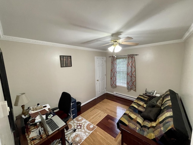 office area with crown molding, baseboard heating, a ceiling fan, wood finished floors, and baseboards