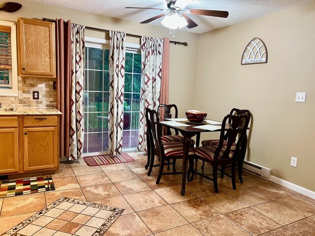 2105 Larkspur Ln, Tobyhanna, PA 18466 - dining room with ceiling fan, a textured ceiling, light tile patterned flooring, and baseboards