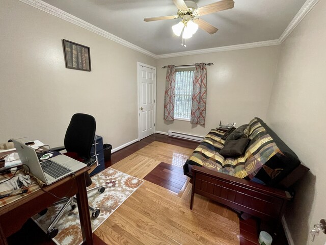 office featuring a baseboard heating unit, ornamental molding, wood finished floors, and baseboards