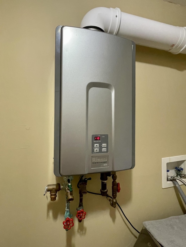 utility room with water heater