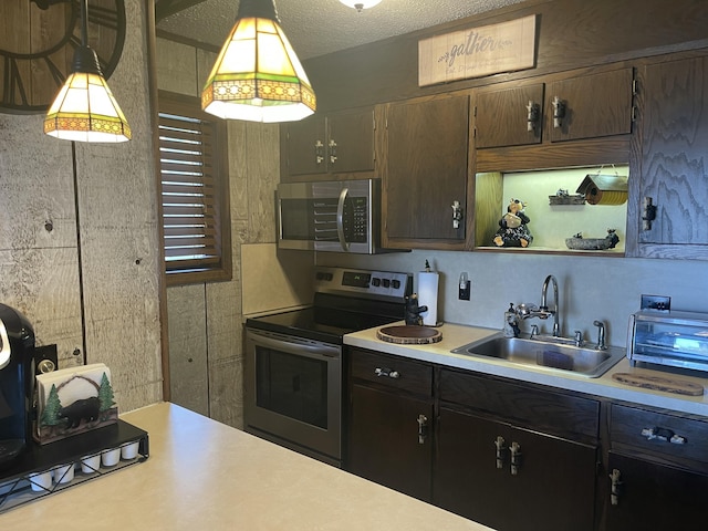 172 Larsen Dr, Clifton Township, PA 18424 - kitchen with light countertops, appliances with stainless steel finishes, open shelves, and a sink