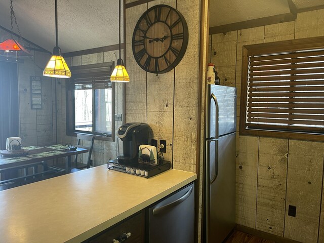 172 Larsen Dr, Clifton Township, PA 18424 - kitchen with decorative light fixtures, stainless steel appliances, a textured ceiling, and light countertops