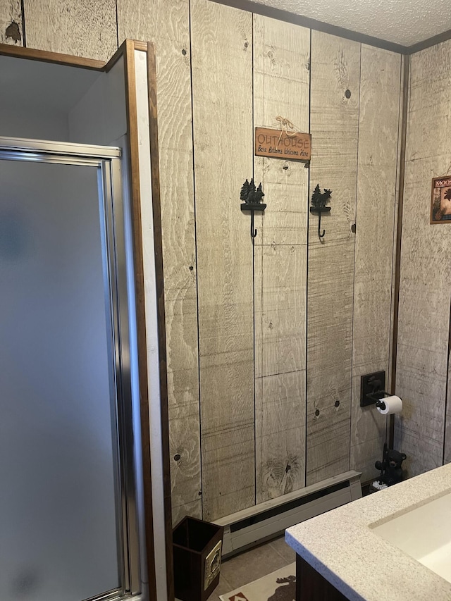172 Larsen Dr, Clifton Township, PA 18424 - full bath featuring a baseboard radiator, vanity, and a shower with door