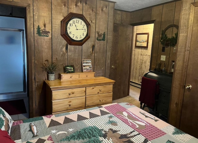 172 Larsen Dr, Clifton Township, PA 18424 - carpeted bedroom with a baseboard heating unit, wood walls, and a textured ceiling