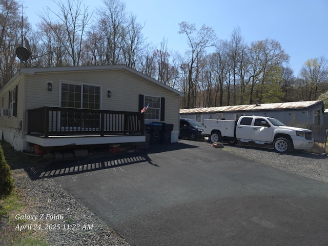 view of front of home with a wooden deck