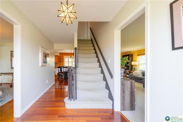 5622 Snowdrift Rd, Orefield, PA 18069 - staircase with wood finished floors, plenty of natural light, and a chandelier