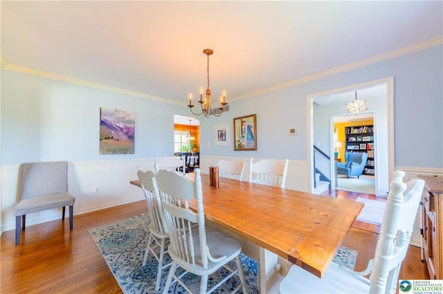 5622 Snowdrift Rd, Orefield, PA 18069 - dining space featuring a chandelier, wood finished floors, a wainscoted wall, and crown molding