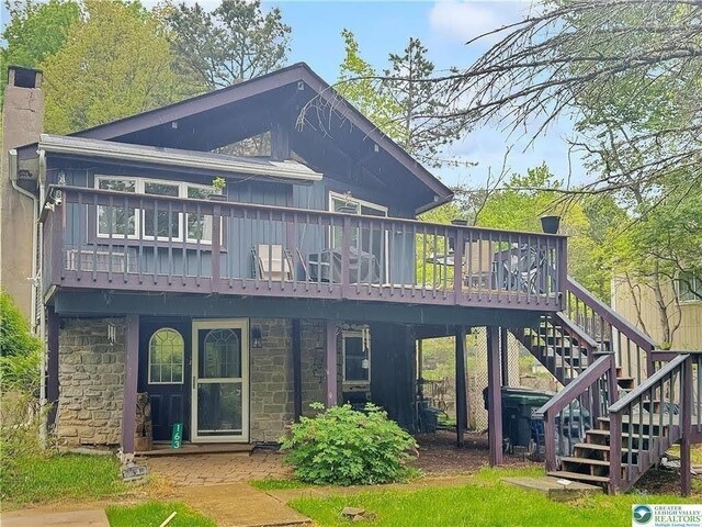 163 Granite Rd, Long Pond, PA 18334 - rear view of property with stone siding, stairway, a deck, and a chimney