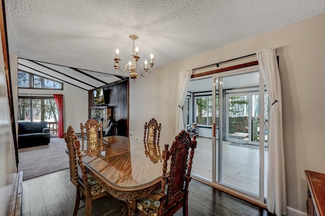 916 Old Stage Rd, Albrightsville, PA 18210 - dining room with a chandelier, a textured ceiling, wood finished floors, healthy amount of natural light, and vaulted ceiling