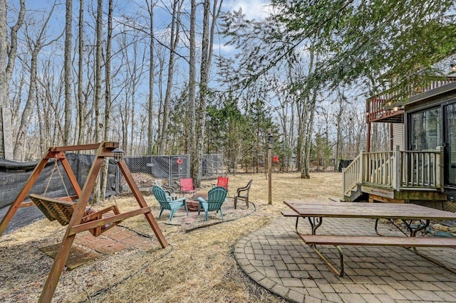 view of yard with a patio, a fire pit, and fence