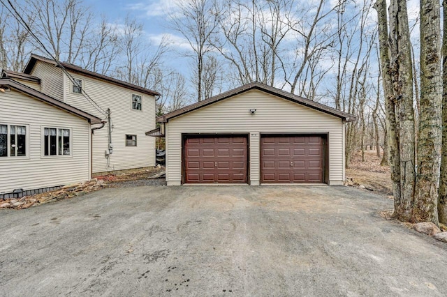 exterior space featuring an outbuilding and a detached garage