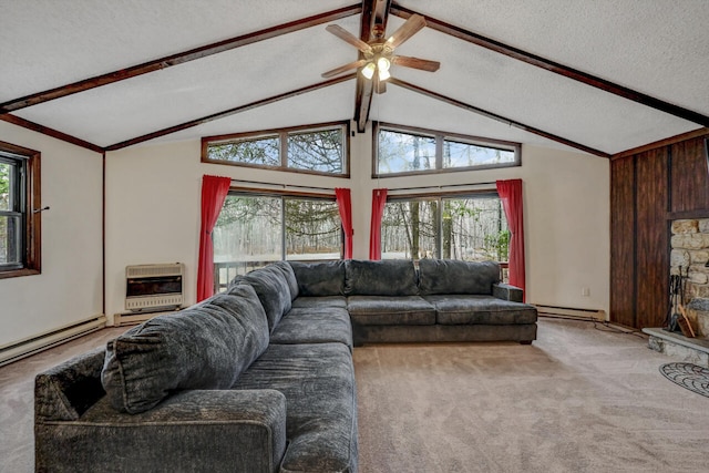 living room featuring heating unit, plenty of natural light, carpet flooring, and a textured ceiling