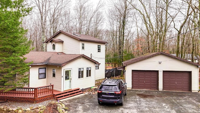 916 Old Stage Rd, Albrightsville, PA 18210 - view of front of property featuring an outdoor structure, a detached garage, a deck, and a shingled roof