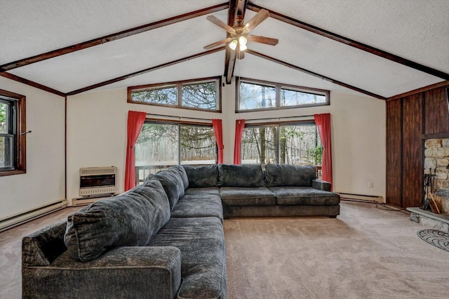 living area with heating unit, plenty of natural light, carpet floors, and a textured ceiling