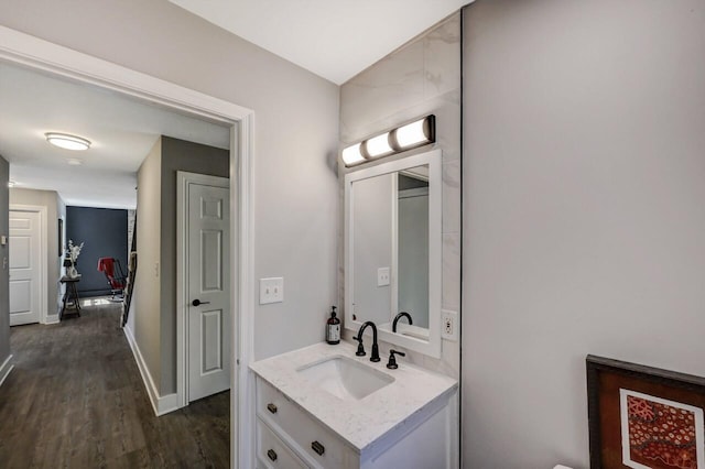 348 Mountain Top Lake Rd, Long Pond, PA 18334 - bathroom with vanity, wood finished floors, and baseboards
