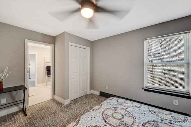 348 Mountain Top Lake Rd, Long Pond, PA 18334 - carpeted bedroom with a closet, baseboards, and a ceiling fan