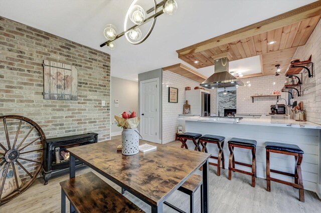 348 Mountain Top Lake Rd, Long Pond, PA 18334 - dining area with light wood-style floors and brick wall
