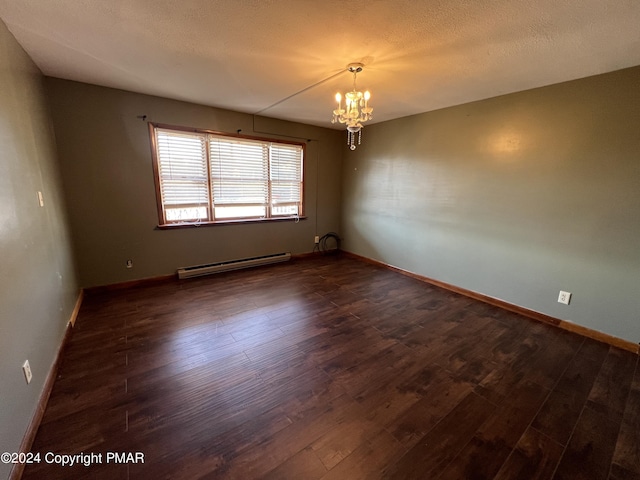 unfurnished room featuring baseboards, dark wood-style floors, baseboard heating, a textured ceiling, and a chandelier