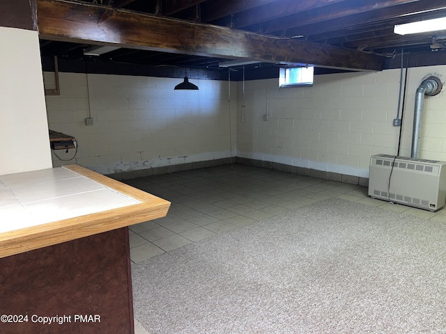 basement featuring heating unit